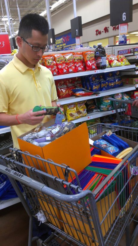 Curtis, FOL’s Chief Operating Officer, buying school supplies to be donated